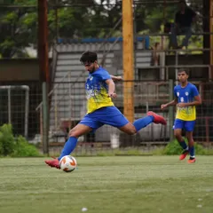 Our midfielder strikes the ball with perfect technique, demonstrating the quality we instill in our players.