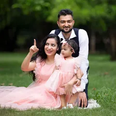 A candid moment from an outdoor family shoot, where the mother points something out to her daughter. These unposed shots add life and story to your gallery.