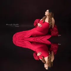 A creative reflection portrait. I used a reflective surface to create this artistic image, mirroring the mother's glow and the beautiful journey she is on.