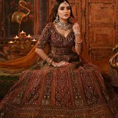 The complete royal bridal look. The rich colors of the outfit and the warm, dramatic makeup come together for a truly unforgettable portrait.