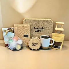 This is a great example of a branded wellness hamper I created for Reebok. It combines my signature sustainable products like a cork notebook and coasters with other thoughtful items, all presented in a co-branded, eco-friendly box.