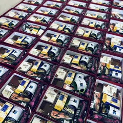 We excel at handling large corporate orders, like this one for Modiwave. Each gift box is carefully packed with branded mugs and a selection of gourmet treats, ensuring a consistent and high-quality brand experience for every recipient.