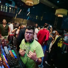 This is the result of a great set. A floor full of people lost in the music, with me right there with them. The motion blur in this shot perfectly captures the dynamic energy of the room.