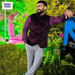 This client chose a rich purple velvet Nehru jacket paired with a patterned shirt for an evening function. We ensure the fit is comfortable yet structured, perfect for celebrating in style.