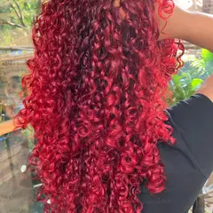 Fiery red on these luscious curls. This is a non-bleach global color that makes the curls look even more vibrant and defined.