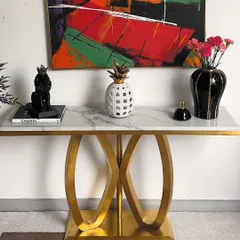 This image shows one way to style our modern console table, featuring a bold abstract painting, a black panther showpiece, and a decorative pineapple. It's a fun and eclectic look.