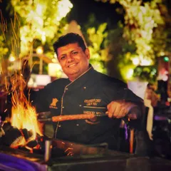 Our founder and celebrity chef, Lalit Tuli, at his favorite station: the grill. His passion for live cooking and authentic tandoori flavors is at the heart of what we do at Tandoori Nights.