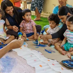 Creating memories together, one activity at a time. This image captures the essence of my program: a community of parents and children learning, playing, and growing together.