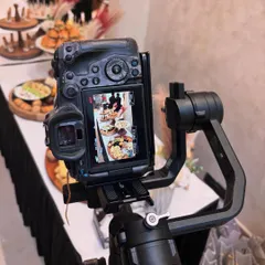 Behind the scenes at the Arte Salon event, with the camera focused on the beautifully arranged grazing table. Every angle is considered to get the perfect shot.
