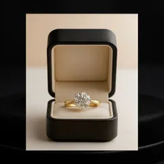 Some pieces do not need an introduction. This classic solitaire ring, resting in its box, is a symbol of forever captured in a single, brilliant stone. It represents a promise, a milestone, or a moment just for you, speaking volumes in its elegant simplicity.