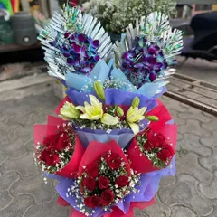 A display of different bouquets ready for New Year's delivery. I can prepare multiple arrangements for parties or corporate gifting, featuring orchids, lilies, and roses.