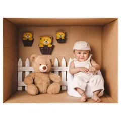 A special delivery of cuteness! This baby boy is sitting with his teddy bear friend in a fun, imaginative 'in the box' portrait.