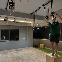 Setting up the gymnastics rings. These are a core part of our training philosophy, so getting them just right was essential.