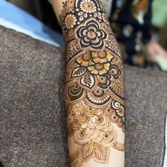 A close-up of the completed floral arm. The use of negative space and bold lines makes the flowers really stand out.