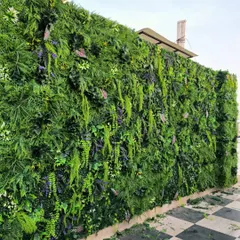 A close-up of a recent premium vertical garden installation in Vikaspuri. Notice the variety of textures and shades of green, with hints of purple, which makes the wall look incredibly realistic.