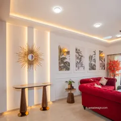 Detail shot of the console area in the Sobha Royal Pavilion project. The sunburst mirror and backlit wall panels add a layer of warmth and luxury, highlighting the neo-classical theme.