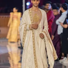 Men's grooming for a model walking in the Abu Jani Sandeep Khosla show at the Jio World Plaza launch. The look is clean and masculine, with subtly defined features.