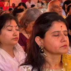 Participants immersed in a deep state of meditation during a special Shiva Puja. The powerful chants and serene atmosphere of our meditation halls help quiet the mind effortlessly.
