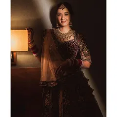 A beautiful bridal portrait using dramatic lighting to create a sense of intimacy and highlight the bride's features.