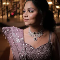 A candid shot of the bride, her lavender-toned makeup perfectly complementing her embellished gown for the sangeet night.