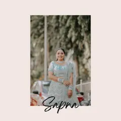 A lovely outdoor portrait of the bride, Sapna. The natural light and background help create a soft and flattering image that showcases her happiness.
