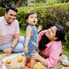 A perfect family picnic in the park. I love capturing families just being themselves, enjoying each other's company. The laughter and interaction here are completely natural and heartwarming.