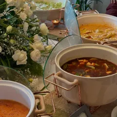 A close-up of our elegant chafing dishes, keeping the main courses like our Thai curries and ravioli perfectly warm for guests.