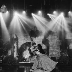 A love story that blossomed from a chance meeting in Central Park deserved a truly magical moment. This black and white shot captures the romance of their first dance, a dip under the spotlights that felt like a scene from an old film.