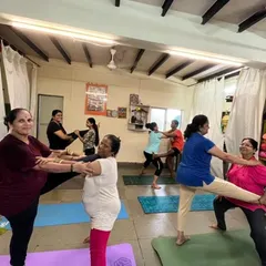 The joy of practicing together is unmatched. In my group classes, we often use partner work to build trust, support, and balance, proving that yoga has no age limit. It's all about finding energy and breathing together.