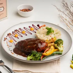 My steaks are a cut above the rest. This tender steak is served with a rich, savory sauce, accompanied by herb rice and a medley of grilled seasonal vegetables for a complete and satisfying dinner.