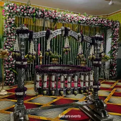 For a naming ceremony, the thottil (cradle) is the heart of the event. I adorn it with intricate floral arrangements, like these jasmine and lotus bud garlands on an ornate silver cradle, making it a beautiful centerpiece for welcoming your little one.