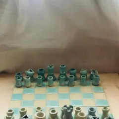 Who says a game of chess can't be charming? I crafted this "Cocoa Clash" ceramic chessboard with quirky, wobbly warriors and soft pastel glazes to bring a playful touch to a classic game.