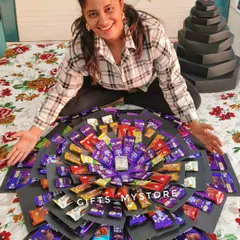 This was a beast! A 10-layer chocolate explosion box for a girlfriend who is crazy about chocolates. It was filled with all her favorites and had a very special surprise hidden in the center.