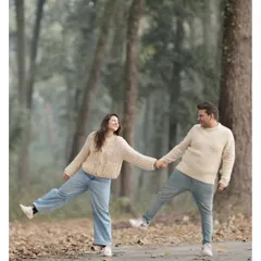 A perfectly synchronized, playful moment between Sayantani and Piyush on a forest path. It’s shots like these, full of movement and laughter, that truly reflect a couple's personality.