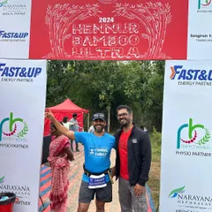 A runner poses with our race director at the Hennur Bamboo Ultra finish line. We pride ourselves on being hands-on and connected with our participants throughout the event.