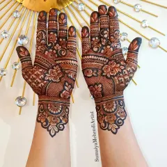 I love how this design combines different elements like florals, checks, and delicate leafy patterns. The filled fingertips complete this rich, celebratory look.