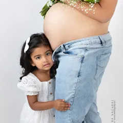 The wait is a family affair. I love including older siblings in maternity sessions, capturing their excitement and curiosity as they anticipate their new best friend. This is a portrait of your family, just as it is, right before it grows by two little feet.