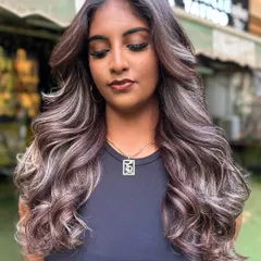 A gorgeous blonde transformation with cool, ashy undertones. We created this look with careful lightening and toning to achieve a sophisticated and modern blonde.