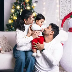Believing in the magic of Christmas is easy with moments like these. A candid shot of a family sharing a loving gaze in our festive setup.
