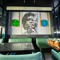 For the NX Lounge in Kolkata, we created a moody and artistic atmosphere. The design features a masculine grey backdrop, dramatic art, and vibrant emerald and cobalt seating to infuse the space with dynamic energy.
