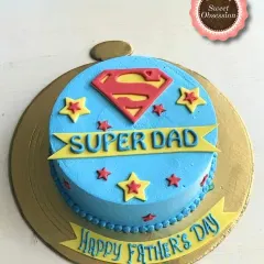 Celebrate your hero with this "Super Dad" cake for Father's Day. The bright blue and yellow design with the Superman logo is a playful way to show him he's your superhero.