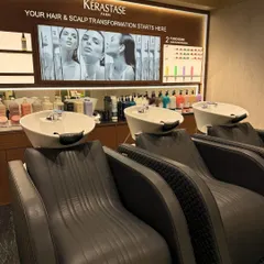 Your hair and scalp transformation starts here. Our backwash stations are equipped with comfortable, ergonomic chairs and premium Kérastase products for a truly luxurious hair wash.