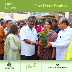 Gifting a plant is a gesture of growth and goodwill. Here, we are sharing a moment with our supporters during the festival's inauguration.