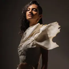 An editorial shoot for the brand Kachiwala. This look is all about wet, glowing skin and a raw, sculptural feel that complements the unique fashion.
