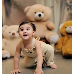 A playful crawling pose from our teddy bear studio session. We capture all the important milestones, including sitting up and crawling.