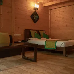 The interior of one of my cozy wooden chalets, offering a rustic and warm retreat after a day of adventure.