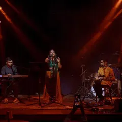 Center stage at The Piano Man, supported by my talented band on keys and mandolin. The warm lighting and engaged audience made for a magical night of Indian classical jazz fusion.