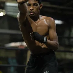 Perfecting the jab in a shadowboxing drill. This fundamental punch is the key to everything that follows. We spend hours on footwork and form to make sure every strike is sharp and effective.