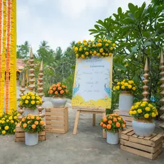 A classic and vibrant welcome setup for a Haldi ceremony. We used bright yellow marigolds, traditional brass props, and a personalized welcome easel to create an inviting and festive entrance for guests.