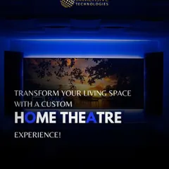 We can transform any living space into a custom home theater. This setup features a large screen complemented by ambient backlighting and strategically placed speakers, proving you don't need a dedicated room to enjoy a cinematic experience.